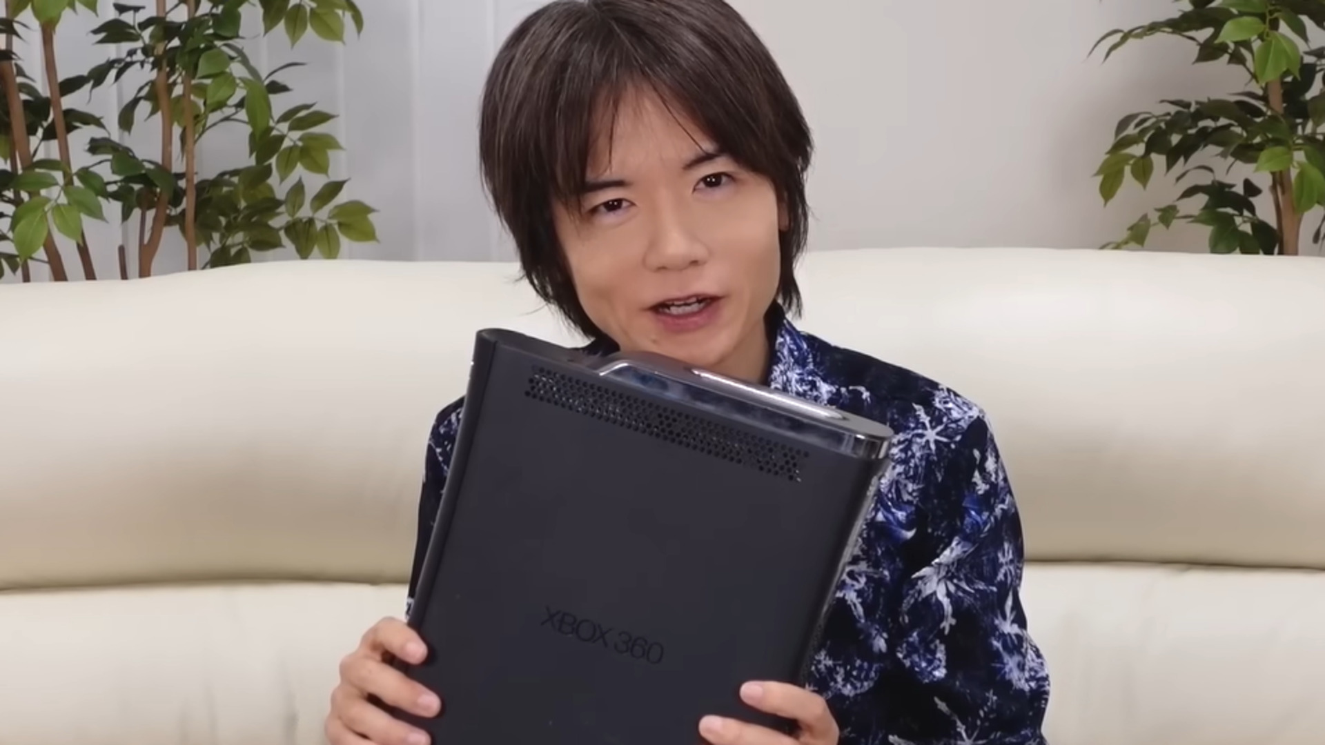 Masahiro Sakurai with his bricked Xbox 360