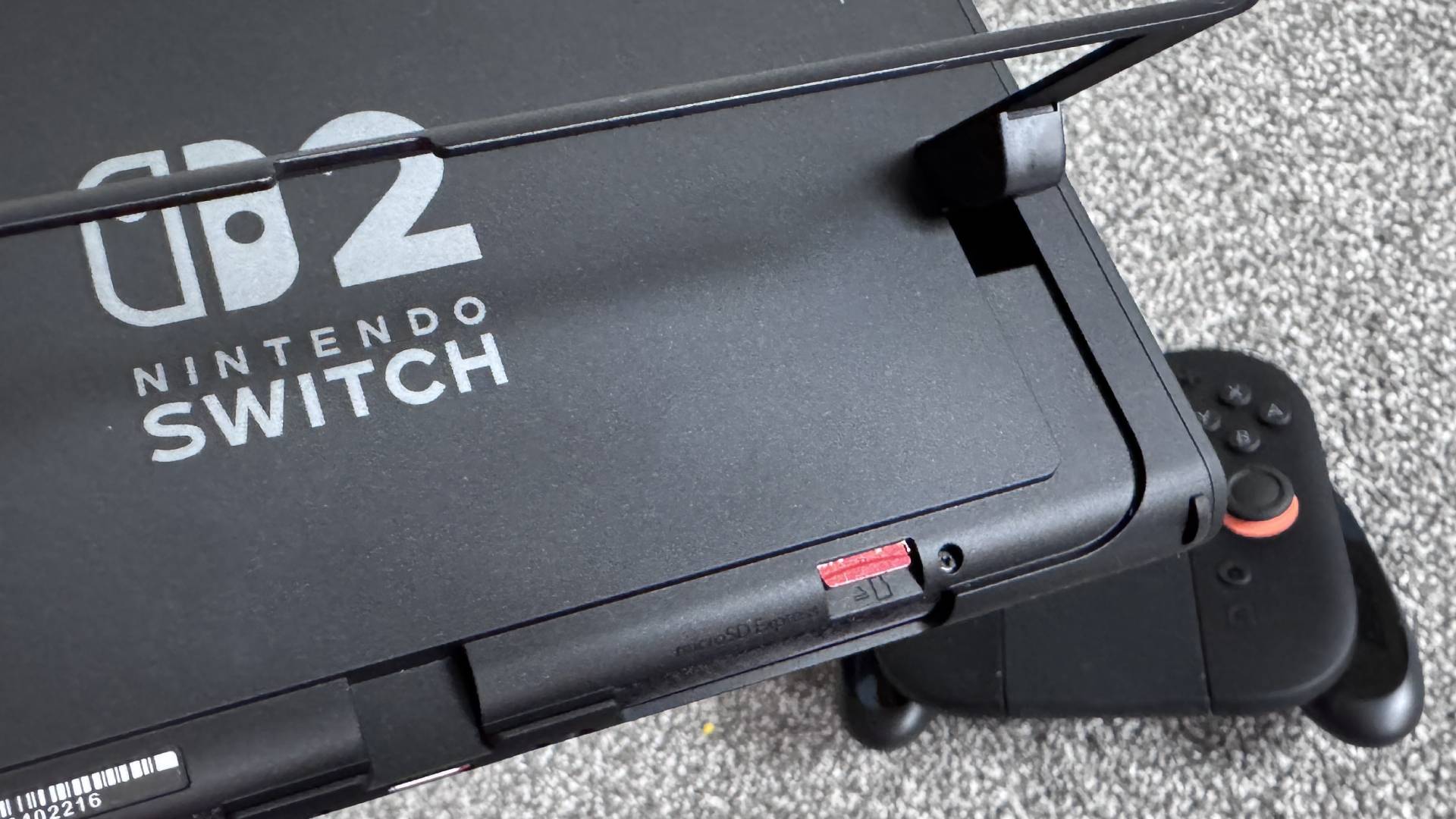 Photo of the back of the Switch 2 taken by Sam Loveridge, featuring the microSD Express Card slot.